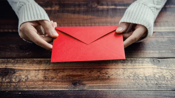 Holding a red envelope